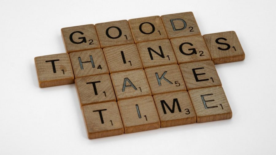 scrabble, scrabble pieces, lettering, letters, wood, scrabble tiles, white background, words, quote, letters, type, typography, design, layout, focus, bokeh, blur, photography, images, image, good things take time, patience, hard work, progress, incremental change, going for the long haul, commit, one day at a time, never give up, keep going, long haul, discipline, practice, practise, turn up,